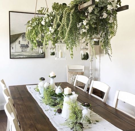 I love the farmhouse style of this dining room, but I love the abundance of plants even more! The hanging plants are definitely a staple piece for the room. #home #homedecor #homedecorideas #homedesign #farmhouse #farmhousedecor #farmhousestyle #farmhousediningchairs #farmhousediningroom #diningroom #diningroomideas #diningroomdecorating #diningroomdecor #inspiration Plant Dining Room, Sunroom Dining Room, Sunroom Dining, Sunroom Decorating, Diy Chandelier, Room Display, Diy Farmhouse Decor, Home Upgrades, Farmhouse Dining