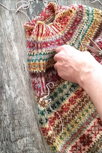 ericka eckles on Instagram: "[image description: a short film showing a piece of Fair Isle Knitting, bands of ever changing motifs knit in a variety of different colours. The knitting lays on a grey wooden board, and is being cut open along especially knit stitches] The yarn used in the picture is all proper Shetland wool, having been spun from actual Shetland breed sheep. I've used an assortment of the 2 ply jumper weight from @thewoolbrokers and the Spindrift from @jamiesonsofshetland. Mot Shetland Knitting, Shetland Wool Week, Knit Stitches, Instagram Image, Shetland Wool, Image Description, Fair Isle Knitting, Wooden Board, Knitting Stitches