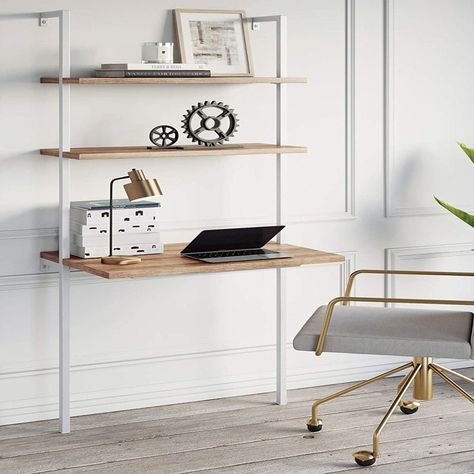 A wall-mounted shelf desk sure to be a brilliant and beautiful way to work from home without making it look like you live to work. On top of that, it's just irresponsibly gorgeous. Small Computer Table, James Theo, Leaning Ladder Desk, Ladder Desk, Small Computer Desk, Nathan James, Wall Mounted Bookshelves, Small Computer, Wall Mounted Desk