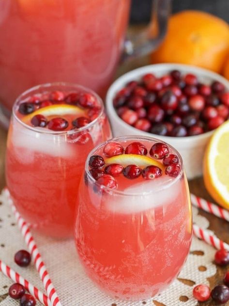 This fruity and festive holiday punch recipe is full of flavor and pizzazz for a delicious cranberry-citrus drink everyone can enjoy! #holidaypunch #drinks #drinkrecipes #nonalcoholic #punch Potluck Drinks Ideas, Sparkling Cider Drinks Non Alcoholic, Breakfast Drinks For A Crowd, No Alcoholic Christmas Drinks, Cranberry Sparkling Punch, Punch Bowl Drinks Non Alcoholic, Cranberry Wine Punch, Sprite Cranberry Punch, White Cranberry Punch Non Alcoholic