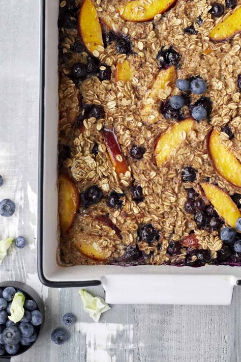 Peach and Blueberry Baked Oatmeal Blueberry Peach Recipes Healthy, Food Dolls Blueberry Baked Oatmeal, Blueberry Peach Oatmeal Bake, Peach Blueberry Baked Oats, Peach Blueberry Oatmeal, Nectarine Baked Oatmeal, Peach Blueberry Quinoa Bake, Healthy Peach Oatmeal Bake, Food Dolls Baked Oatmeal