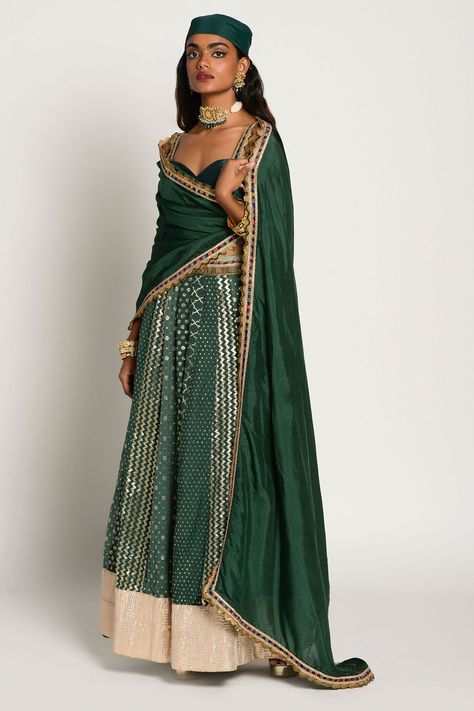 Bottle green lehenga with contrast geometric motifs and contrast panel. Paired with sleeveless blouse and dupatta. Component: 3 Neckline: Sweetheart Sleeve Length: Sleeveless Fabric: Chanderi, Dupion, Opara silk Color: Green Embroidered waistband Geometric motifs - Aza Fashions Emerald Green Blouse, Blue Embroidered Top, Green Lehenga, Geometric Motif, Indian Fashion Designers, Purple Fabric, Bottle Green, Green Blouse, Couture Collection