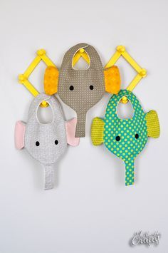 My awesome sister-in-law just had a little baby boy. She shared a photo of some combo bib binkie holders with me on Facebook. I thought they were pretty handy but not so cute, so I went to work designing a bib/binkie holder that was a bit more my style. Thus was born the elephant bib … Elephant Bib, Pacifier Bibs, Bib Pattern, Baby Sewing Projects, Quilt Baby, Baby Projects, Baby Diy, Baby Crafts, Sewing For Kids