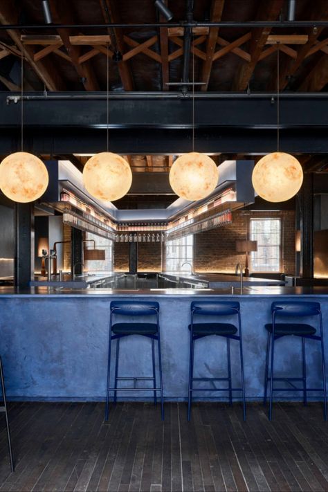 Dark woods and moody blue hues evoke the piney notes and sharp flavour of juniper berries inside Sydney’s Four Pillars gin emporium in Surry Hills.  The Yarra Valley-based distillery’s hub includes a gin lab, bottle store and a cocktail bar designed by Yasmine Saleh Ghoniem.  Photography: Anson Smart   #sydney #australia #design #interiors #interiordesign #interiorstyle #travel Gin Bar Design, Brewery Restaurant Design, Dark Blue Bar, Bar Counter Design Home, Anson Smart, Cocktail Bar Interior, Dark Bar, Cocktail Bar Design, Wood Cafe