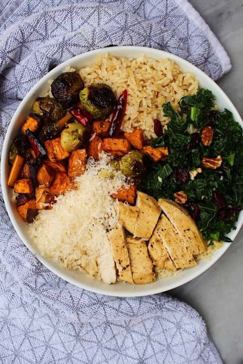 Fall harvest bowls containing rice, roasted vegetables, kale, and cheese in a white bowl. Fall Harvest Bowl, Chicken Sweet Potato Bowl, Harvest Bowl, Chicken And Kale Recipes, Chicken Brussel Sprouts, Cranberry Quinoa Salad, Veggie Rice Bowl, Sprouting Sweet Potatoes, Sweet Potato Bowls