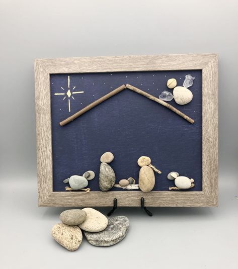 "One of a kind rock art : \"nativity\"  This item will be made to order and is guaranteed to be as unique and the rocks!  I have 2 nativity listings- this one only comes in 8x10 and will have 2 extra animals in the manger scene.  Each piece is hand made with the rocks I have collected mostly from right here in the beautiful Montana Rocky Mountains.  Since no two rocks are exactly the same no two creations will be either.  I cannot supply exact images and would be happy to send you a photo of the Framed Rock Art, Rock Nativity, Christmas Neighborhood, Diy River Rock, Nativity Scene Diy, Neighborhood Gifts, Rustic Christmas Gifts, Christmas Pebble Art, Rock Pictures