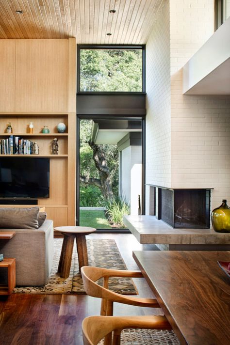 Inside a mid-century home reimagined with stunning details on Lake Austin Contemporary Fireplaces, Ranch Renovation, House Lake, Build Inspiration, Eichler Homes, Walnut Floors, Standing Rock, Open Living, Mid Century Modern Living