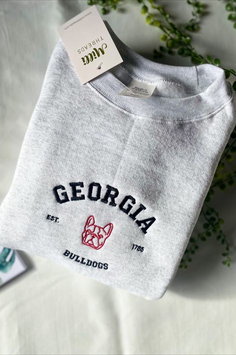 Embroidered university of Georgia with red bulldogs on the ash color sweatshirt. Georgia Sweatshirt, Bulldog Sweatshirt, Color Sweatshirt, University Style, Custom Fans, Live Now, Sports Sweatshirts, Sweatshirt Vintage, Georgia Bulldogs