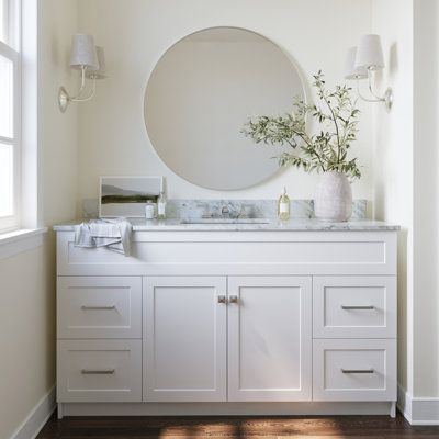 Give your bathroom décor a makeover with a modern bathroom vanity from ARIEL Bath. The Hamlet series offers solid hardwood plywood cabinets with a variety of hardware finishes available on the cabinet doors and drawers. Available as a standalone cabinet or with a marble or quartz countertop; with so many options of cabinet colour and hardware finishes and countertops, you can be sure you'll find the perfect match for your bathroom! | Red Barrel Studio Hamlet 61" Single Bathroom Vanity Set White 36.0 x 61.0 x 22.0 in | ZZB10430_70315852 | Wayfair Canada White Bathroom Vanity, Plywood Cabinets, Bathroom Red, Solid Wood Cabinets, Cabinet Color, Hardwood Plywood, Vanity Room, Single Sink Vanity, Quartz Countertop