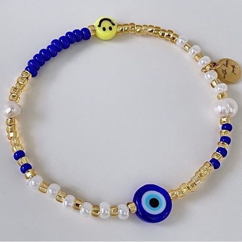 Evil Eye Smiley Face Beaded Bracelet You Will Receive (1) Bracelet Made Using: Made Using, Lampwork Evil Eye Bead (Not Plastic), Freshwater Pearls, Acrylic Yellow Smiley Face Bead, Czech Glass Beads And Finished With A 14k Plated Charm-Tarnish Resistant. Sizing Child 2-4yrs Child 5-7yrs Child 8yrs & Up Adult - S - 6.5” Adult - M - 7.0” Adult - L - 7.5” Adult - Xl - 8.0” Select Your Size, After Ordering, Simply Send Me A Message Indicating What Color You Want, Or I Will Message You :) Every Order Beaded Evil Eye Bracelet Ideas, Blue Casual Stretch Bracelet For Festivals, Casual Blue Stretch Bracelet For Festival, Casual Blue Friendship Bracelets With Evil Eye, Blue Letter Beads Friendship Bracelets For Festival, Blue Friendship Bracelets With Letter Beads For Festivals, Casual White Beaded Evil Eye Bracelet, Simple Beads Bracelet, Evil Eye Bracelet Ideas