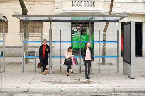 Group of people waiting separately under a shelter at a bus stop in the city Waiting At Bus Stop, Bus Shelters, City Bus, Story Board, Group Of People, Poster Ideas, Photo Makeup, Bus Stop, Bleach Anime