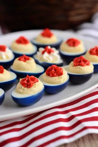 Discover the joy of making Red White and Blue Deviled Eggs with this simple recipe. It combines creamy yolks with vibrant red and blue egg whites for a festive Fourth of July or Memorial Day treat. Perfect for holiday gatherings, picnics, and potlucks. Get the recipe now and add a patriotic pop to your spread! Red White And Blue Deviled Eggs, Blue Deviled Eggs, Patriotic Appetizers, Gluten Free Egg Free, Blue Eggs, Deviled Egg, Blue Food, Dry Mustard, Deviled Eggs