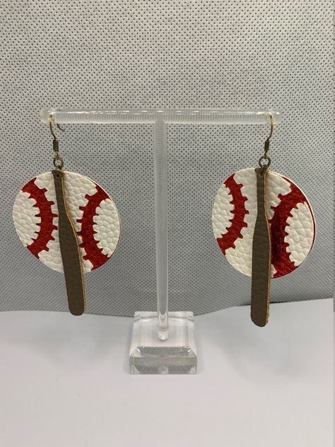 Two layer circle faux leather earring with a baseball & bat. As shown in matte white & shimmer red & brown. but can be customized with any colors, just message me for details. Metal color options are: Gold, Silver, Rose Gold and Antique Gold. Faux Leather Earring, Bat Ball, Baseball Earrings, Shamrock Earrings, Homemade Earrings, Bat Earrings, Leather Earring, Party Earrings, Red Brown