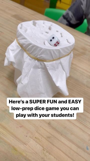 Alea on Instagram: "Here’s a SUPER fun and easy dice game you can play with you students in a small group. I call it dICE breaker — you’ll see why! 😜 You just need: -a cup -a tissue paper -a rubber band -2 dice -a pencil Secure the tissue paper over the cup with a rubber band, then put one of the dice on top. To play, have a student read/answer a question on whatever topic you guys are covering at the moment. Then, that student will roll other the dice. Whatever number shows is the number of Roll The Dice Break The Ice, Water Cup Game, Cup Punch Game Tissue Paper, Punch A Cup Game Tissue Paper, Grinch Games, Dice Game Rules, Resident Activities, Dice Math Games, Ice Games