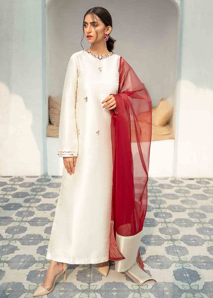 Color: White Fabric: Raw Silk Work Technique: Handpicked pearls, stones & Crystals Description: This Majestic! Crispy long tunic features crew neckline mounted with handpicked pearls, stones & Crystals. Paired with straight fitted pants and contrast Dupatta to complete the Royal LOOK! Length: 49’’ Outfit: Raw Silk Dupatta: Organza Model is Wearing size XS Note: You can buy this outfit in 2 options: 2 piece 2 Piece + Dupatta Disclaimer: Color of outfit may vary due to photographic lightin 50’s Outfits, Contrast Dupatta, Shalwar Suit, Best Designer Suits, Wedding Fits, Quilted Sleeves, Pakistani Formal Dresses, Fitted Pants, Silk Set