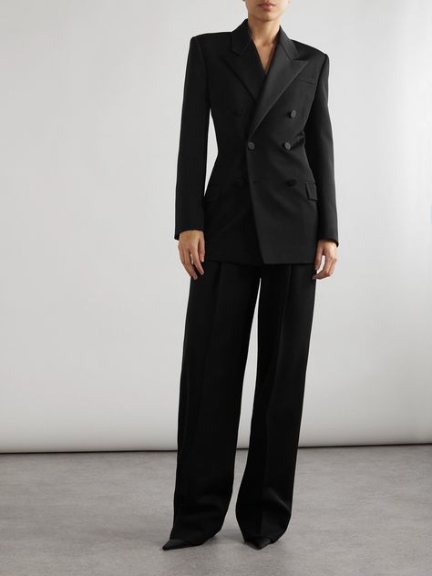 A reinterpretation of traditional tuxedo jackets, SAINT LAURENT's double-breasted blazer is designed with a nipped-in waist balanced by angular, structured shoulders. It's made from grain de poudre wool and has twill-trimmed peak lapels and covered buttons, including at the cuffs. Modern Suits For Women Black, Formal Party Outfit Classy Blazers, Balmain Suit Women, Ysl Suit Women, Black Suit Women Aesthetic, Classic Jackets For Women, All Black Suit Women, Woman Suit Black, Tuxedo For Woman