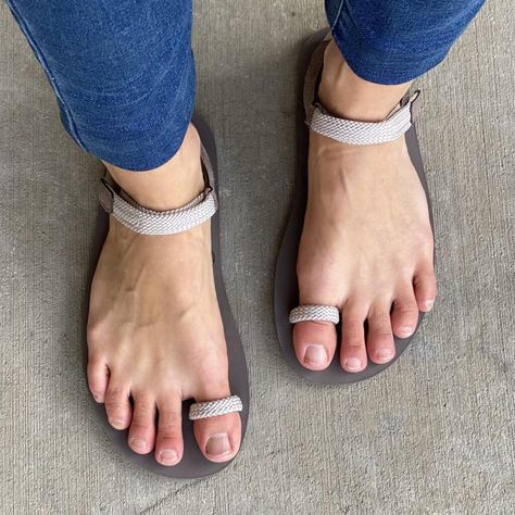 A top down view of a pair of feet standing on concrete wearing the Xero Shoes Jessie barefoot summer sandal in Cashmere grey Xero Shoes Women, Anya's Reviews, Grecian Sandals, Minimalist Sandals, Custom Sandal, Xero Shoes, Adventure Sandals, Woman Sandals, Barefoot Sandal