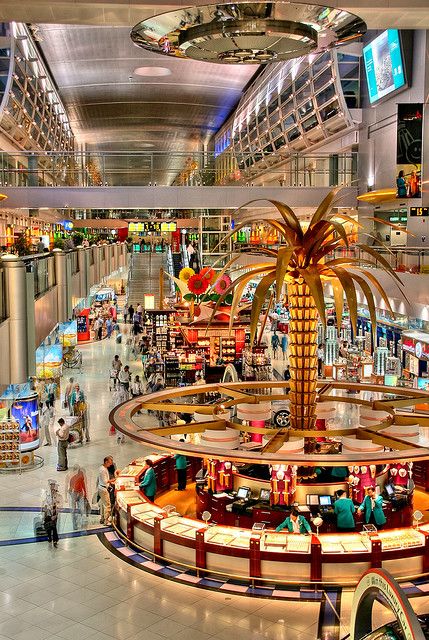 Dubai airport   - Explore the World with Travel Nerd Nici, one Country at a Time. http://TravelNerdNici.com Dubai International Airport, Dubai Airport, International Airport, Dubai, Walking, Gold