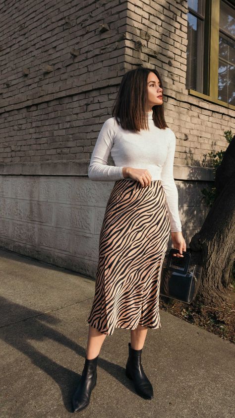 Tiger Print Midi Skirt. Click to shop this outfit. Work Outfits Women Midi Skirt, Skirts And Long Sleeves Outfits, H&m Skirts Outfit, Skirt Outfits Ideas Casual, Women Winter Skirt Outfits, Long Skirt Outfits For Office, Winter Outfits Skirt Midi, Skirt Outfits Pose, Skirts Autumn Outfit