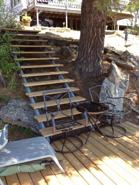 Custom built stairs with wooden treads and welded steel framing. From top of hill down to a Mid deck just above the main dock. Deck Stair Stringer, Landscape Stairs, How To Build Steps, Deck Steps, Building Stairs, Sloped Backyard, Stair Railing Design, Garden Stairs, Outdoor Steps