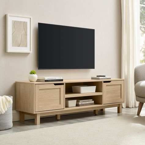 Create your very own relaxation station with this entertainment setup. This TV stand can sit stylishly in your small space or forever home, and it offers plenty of room for all your media and other entertainment essentials. Tv Entertainment Center Ideas Small Spaces, Entertainment Center Ideas Small Space, Light Oak Living Room Furniture, What To Put Under Mounted Tv, Minimal Tv Stand, Small Tv Console, School Apartment, Coastal Oak, Minimal Profile