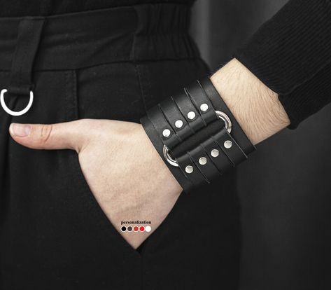 "⚡️ more wide bracelets ➡️ https://www.etsy.com/shop/LL910?ref=seller-platform-mcnav&section_id=24058852 🔥 buy 2 - free shipping 🔥 buy 3 - save  The black leather wide cuff bracelet with a metal oval element is must-have today. Our men women wristband adding and completing any image in fashion gothic outlook. This gothic jewelry bangle is a perfect best friend gift idea. The arm wrap bracelet in rock style is unisex minimal jewelry. Such rock cuff bracelet got the second birth and became relevant, like never before.    Width: 2.35 inch (6 cm) WRIST size:  from 4.7 to 5.5 inch  (12-14 cm) from 5.5 to 6.1 inch  (14-15,5 cm) from 5.9 to 6.7 inch  (15-17 cm) from 6.3 to 7.0 inch  (16-18 cm) from 7.5 to 8.3 inch  (19-21 cm) from 8.6 to 9.4 inch (22-24 cm) custom size Lock: snap Material: genu Leather Wrist Cuff, Large Bracelet, Wide Cuff Bracelets, Leather Wristbands, Style Rock, Wristband Bracelet, Wide Bracelet, Bracelet Cuir, Minimal Jewelry