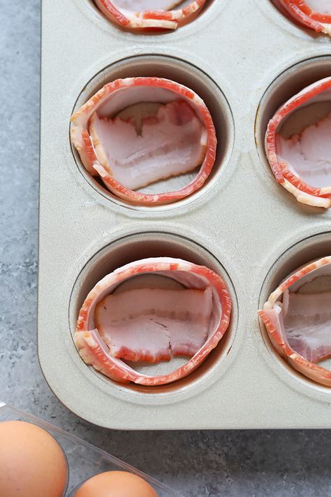 In less than 30 minutes you'll have a high-protein breakfast or snack prepped for the entire week! These bacon baked eggs are made with just 2 ingredients and are gluten-free and paleo-friendly. Bacon Breakfast Cups, Bacon Wrapped Egg Cups, Bacon Wrapped Eggs, Carnivore Egg Muffins, Egg Bacon Muffin Cups, Bacon Cups With Eggs, Bacon And Egg Breakfast Cups, Fishing Snacks, Bacon Egg Cups Breakfast