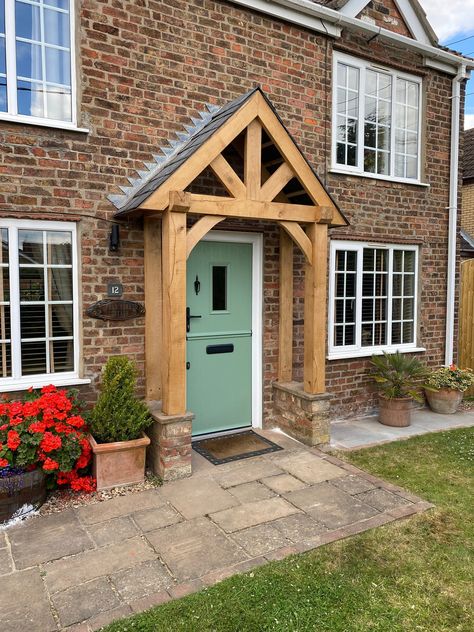 Solid Oak Porch Frame made to Order. Expertly Carved out of Solid Green untreated Oak, Sanded and ready to be assembled and installed. This Product can be installed for an additional fee if requested. WIDTH: The width on the listing is the overall width (roof overhand included) The inside space inbetween that for the opening is approx 60cm less than the overall width. We appreciate that not every width will be to your liking so if you're unsure, Round what width you want up to the nearest amount when ordering. Want it wider? Drop us a message!  All roofs are at 45 Degrees unless specified. DEPTH. Standard Depth is Approx. 60cm unless specified. Please note we can make this up to 90cm at NO EXTRA CHARGE!) We can cater to exact measurements if needed to make sure you're porch is perfect. PLE Small Oak Porch, Brick Entrance Front Porches, Back Door Styles, Green Oak Porch, Small Open Porch Ideas, Outside Doors Entrance Front Entry, Peaked Front Porch, Old House Front Door, Arched Porch Entrance