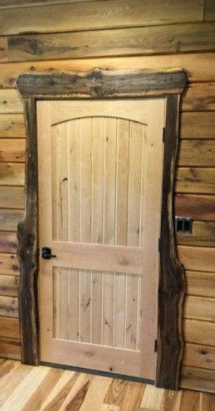 Wood Trim Halfway Up Wall, Nutmeg Hickory Flooring Lifeproof, Wood Door Frame Ideas, Log Cabin Doors, Rustic Door Trim, Rustic Trim Ideas, Log Cabin Front Door, Live Edge Wood Projects, Rustic Trim