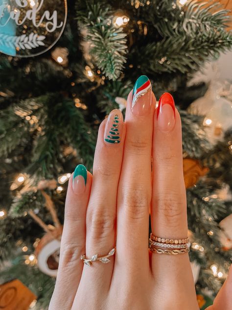 White Nails With Red And Green Glitter, Clear Nail Christmas Designs, Christmas Tree Acrylic Nails, Green White And Red Nails, Christmas Tree Nails Acrylic, Green And Red Nail Art, Clear Holiday Nails, Tree Nails Christmas, Nail Art Christmas Tree