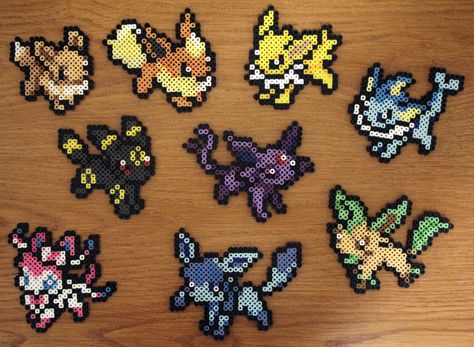 Perler Fuse Bead Eevee and it's 8 Eeveelutions by PkmnMasterTash Eevee Evolutions Perler Beads, Pokemon Perler Bead Patterns Eevee, Evee Evolution Perler Beads, Eevee Perler Beads, Eeveelutions Perler Bead Patterns, Eevee Perler Bead Patterns, 3d Pokemon Perler Beads, Eevee Perler, Perler Beads Pokemon