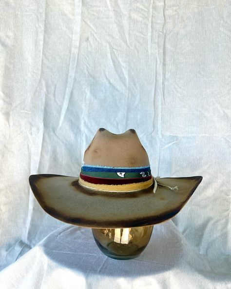 “Rambler” Custom burned and banded chestnut brown cowboy hat adorned with hand sewn details, denim, twine, multiple fabrics and a turkey feather. Very good quality cashmere wool felt hat. One of a kind. Size 6 7/8 $275 https://theroguecowpoke.etsy.com/listing/1807969623 Brown Cowboy Hat, Turkey Feathers, Chestnut Brown, Felt Hat, Hats For Sale, Cashmere Wool, Cowboy Hat, Custom Hats, Chestnut