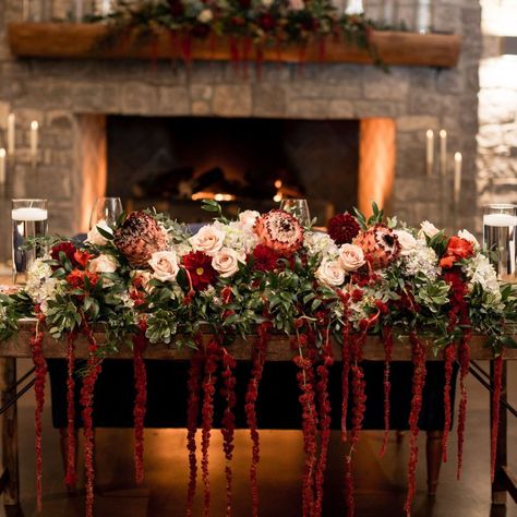 Bask in the glow of true love with a one-of-a-kind arrangement for your sweetheart table 😊 Fall Sweetheart Table Flowers, Cascading Sweetheart Table Arrangement, Valentines Installation, Red Sweetheart Table, Burgundy Sweetheart Table, Sweetheart Table Candles, Sweethearts Table, Red Reception, Christmas Shooting