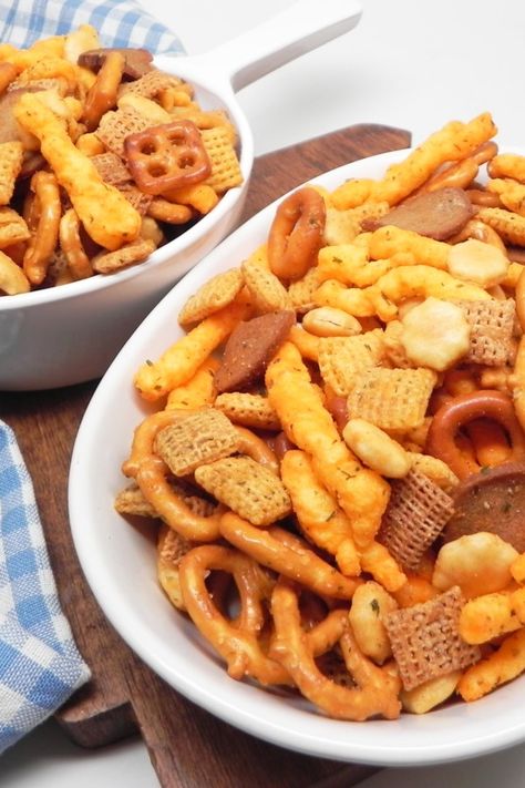 No-Bake Snack Mix | "This is my mom's no-bake snack mix recipe, and it's so much better than the normal snack mix recipes out there. It's tangy, spicy, and insanely addicting!" #footballrecipes #gamedayrecipes #tailgatingrecipes #superbowlrecipes #superbowlparty #superbowlpartyideas Snack Mix No Bake, Easy Chex Mix Recipes No Bake, No Bake Chex Mix Recipes, Easy Snack Mix Recipes No Bake, No Bake Snack Mix Recipes, Toddler Snack Mix Ideas, Cracker Mix Recipes, Snack Mix Recipes Savory, Cheesy Snack Mix