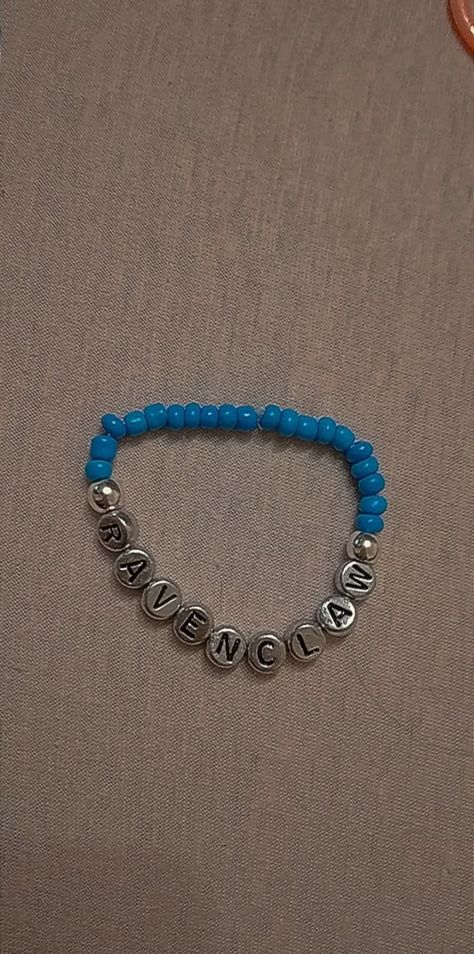 harry potter ravenclaw beaded bracelet made with blue seed beads and silver letter beads Ravenclaw Bracelet, Bracelets Ideas, Harry Potter Ravenclaw, Ravenclaw, Wizarding World, Infinity Bracelet, Beaded Bracelet, Harry Potter, Beaded Bracelets