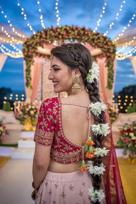 Embrace the elegance of South Indian culture with this breathtaking wedding hairstyle, perfect for the modern bride. Adorned with traditional jasmine flowers and intricately braided, this look captures the essence of timeless beauty and grace. Ideal for showcasing your facial features, it complements any wedding attire beautifully. Discover the charming details of South Indian wedding hairstyles and make your big day unforgettable! #weddinghairstyles #SouthIndianWeddingStyles Indian Bridal Hair Flowers Braid Hairstyles, Wedding Day Hairstyles Indian, South Indian Bride Braid, Indian Wedding Braid, South Indian Wedding Hairstyles Braids, Hair Flower Braid, Wedding Reception Hairstyles, South Indian Culture, South Indian Wedding Hairstyles