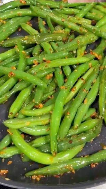 @thefeedfeed on Instagram: "Comment ‘RECIPE’ to have this Chili Crisp Green Bean recipe by @caileeeeats sent to your DMs 💚  These Chili Crisp Green Beans are the perfect balance of spice and crunch. Made with Trader Joe’s Chili Onion Crunch, this easy recipe is ready in just minutes!   INGREDIENTS: 12 ounces trimmed green beans 1/4 cup water 2 tablespoons unsalted butter 2 tablespoons chili onion crunch (Trader Joe’s or similar) 1/4 teaspoon garlic powder Kosher salt, to taste  RECIPE: 1. Heat a pan over medium heat. Add the green beans and ¼ cup of water. Cover and steam for about 4 minutes. Be careful not to overcook, or the beans will become mushy. 2. Remove the lid and let the water evaporate (about 1-2 minutes). 3. Add butter and stir until melted. 4. Mix in the chili onion crunch un Chili Onion Crunch, Green Bean Recipe, Chili Crisp, Bean Recipe, Steamed Green Beans, Cup Of Water, Vegetable Side, Green Bean Recipes, Food Tasting