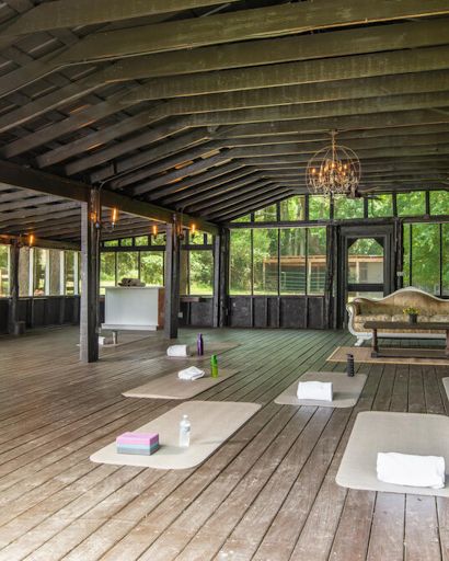 Step into the rustic sanctuary of our barn and discover a haven of tranquility and inspiration. With its weathered wooden beams and open space, it provides the perfect setting for rejuvenating activities such as yoga, meditation, or group fitness classes. Let the barn be your sanctuary as you embark on a revitalizing retreat. Outdoor Yoga Space, Columbia Tennessee, Columbia Tn, Yoga Studio Design, Yoga Space, Group Fitness Classes, Luxury Amenities, Outdoor Yoga, Fitness Classes