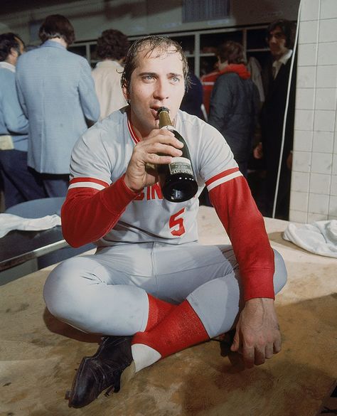 Cincinnati Reds catcher Johnny Bench celebrates with a bottle of champagne in the team’s locker room after winning Game 7 of the World Series against the Boston Red Sox on Oct. 22, 1975 at Fenway Park in Boston. The 1968 NL Rookie of the Year, two-time NL MVP, 1976 World Series MVP, 14-time All-Star and Hall of Famer turned 68 years old today, Dec. 7, 2015. (John D. Hanlon for SI)GALLERY: Rare SI Photos of Johnny Bench Neil Leifer, Johnny Lee, Johnny Bench, Cincinnati Reds Baseball, Vintage Muscle Cars, Cover Illustration, Buddy Holly, Vintage Muscle, Guy Stuff