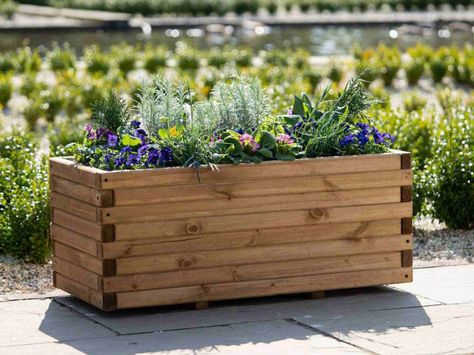 Add drainage to the bottom of your planters to help keep your plants healthy. In this guide, we share what to put in a planter for drainage. Raised Flower Bed, Wooden Trough, Trough Planter, Raised Flower Beds, Outdoor Fireplace Patio, Trough Planters, Terrarium Plants, Wood Planters, Small Planter