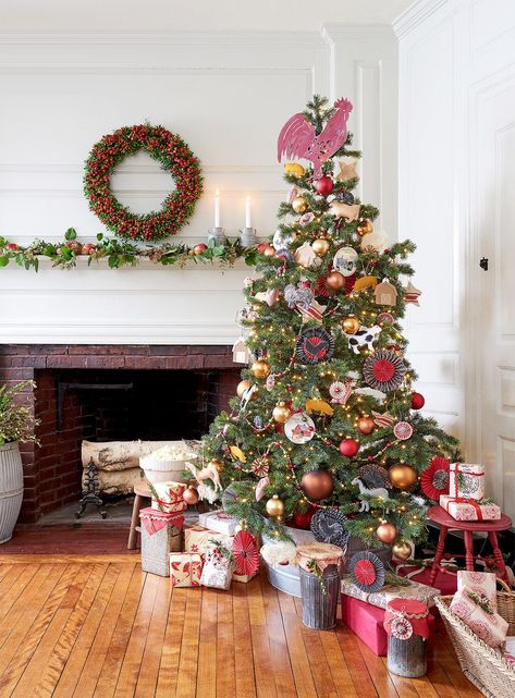 Enjoy this merry collection of farmhouse Christmas decorating ideas. From burlap tree skirts to hand-strung garland, there are dozens of easy ideas to get the modern rustic look. Unwrap the style that delights you with plenty of neutral designs paired with natural accents as well as colorful designs that will fill any home with joy. #farmhouse #christmas #christmasdecorations #garland #christmastrees #decoratingideas #bhg Farm Animal Christmas Tree, Barnyard Christmas, Diy Christmas Tree Ideas, Animal Christmas Tree, Christmas Outdoors, Fashion Christmas Tree, Farmhouse Christmas Decor Ideas, Burlap Tree Skirt, Burlap Trees