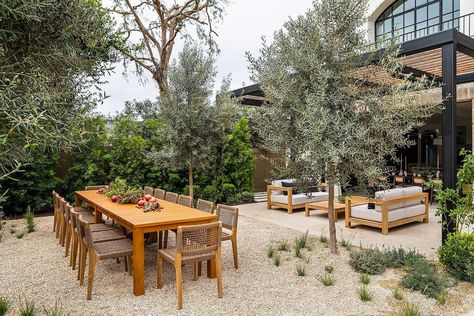 Tour a transitional Southern California home with charming French style Backyard Dining Table, Southern California Home, Wood Trellis, Alfresco Dining Area, Gravel Patio, French Style Homes, Alfresco Dining, Teak Dining Table, Garden Studio