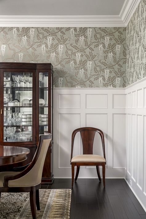 Love this molding and the dramatic wallpaper above. High Wainscoting With Wallpaper, Dining Room Millwork Wainscoting, Office With Wainscoting And Wallpaper, Dining Room Vertical Shiplap, Tall Wainscoting With Wallpaper, Dining Room Wallpaper And Wainscotting, Dining Room With Wainscoting And Wallpaper, Wainscotting With Wallpaper Above, Shiplap And Wallpaper Dining Room