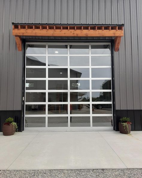 Garage Door Bar Window, Barndominium Glass Garage Doors, Barndominium Glass Garage Door, Barndo Glass Garage Door, Mountain Modern Living Room, Modern Pole Barn, Clear Garage Doors, Amarr Garage Doors, Overhead Garage Door