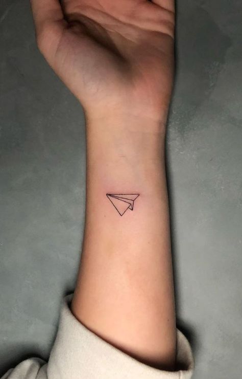 Tiny Paper Plane Tattoo Kehlani Paper Plane Tattoo, Paperplanes Tattoo, Paper Airplane Tattoo Taylor Swift, Plane Tattoo On Wrist, Two Paper Airplanes Flying Tattoo, Tiny Plane Tattoo Simple, Paper Airplane Tattoo, Small Plane Tattoo Airplane, Paper Airplane Tattoos