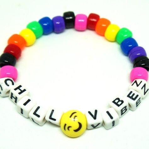 Rainbow Smiley Kandi Bracelet - Describes design and style 🌟 #EDCKnifeBeads #KnifeAccessories #EverydayCarry #EDC #GearCustomization #TacticalBeads #ParacordBeads #HandcraftedBeads #ArtisanBeads #KnifeCollecting #KnifeEnthusiast #GearUpgrade #UniqueBeads #FunctionalArt Festival Kandi, Kawaii Kandi, Diy Kandi Bracelets, Diy Kandi, Kandi Cuff, Kandi Ideas, Healing Gemstone Bracelets, Edm Rave, Word Bracelet