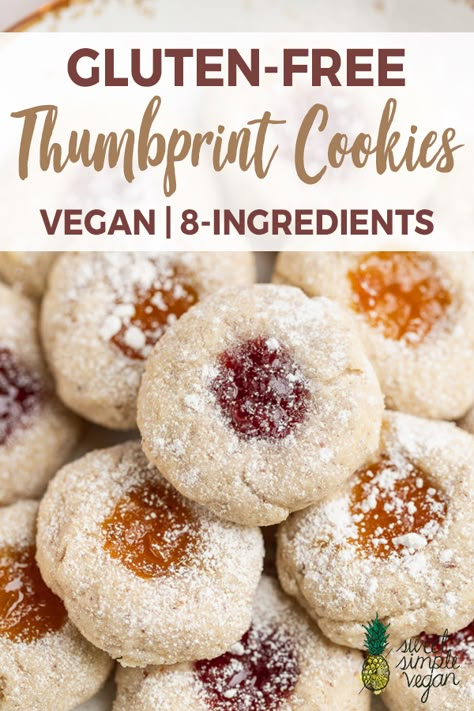 These gluten-free thumbprint cookies are easy to make, require just 8 ingredients and will be ready in 35 minutes. They make the perfect Christmas cookies, your family and friends will love them! #vegan #glutenfree #thumbprint #cookies #dessert #jam #christmascookies #veganized #sweetsimplevegan #vegancookies Gluten Free Vegan Cookies Christmas, Gluten Free Vegan Thumbprint Cookies, Vegan And Gluten Free Christmas Cookies, Vegan Gf Cookies Recipes, Gluten Free Dairy Free Thumbprint Cookies, Christmas Cookies Vegan Gluten Free, Gf Cookies Christmas, Gf Thumbprint Cookies, Gluten Free Thumbprint Cookies Recipe