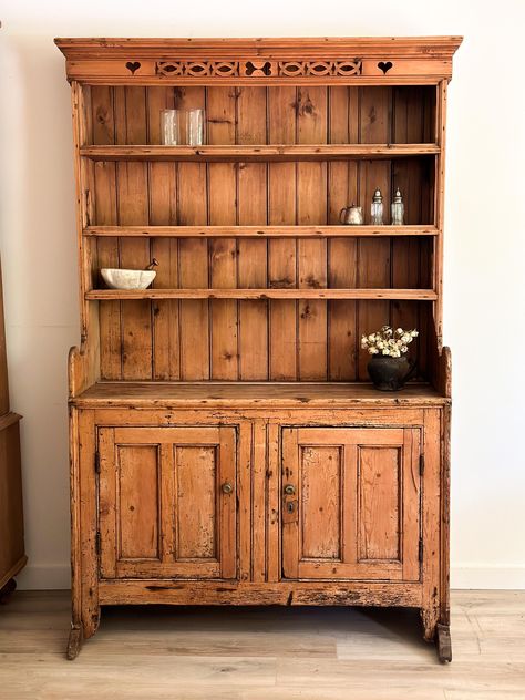 Irish Pine furniture is renowned for its warmth, character, and durability. This stunning hutch has intricate detailing, rich patina, and graceful proportions. This Antique Irish Pine Hutch Cupboard is not only a beautiful decorative piece but also a practical addition to your home. Featuring multiple shelves and drawers, this hutch cupboard is perfect for organizing and displaying. Dimensions: **Due to the unique antique and vintage nature of our pieces, all sales are final and sold as is. Our items are one-of-a-kind and can have wear consistent with age, including nicks, cracks, and patina which only adds to the character. Please be sure to ask any questions related to condition prior to purchase.** Vintage Furniture In Kitchen, Antique Craft Room, Antique House Interior, Diy Kitchen Hutch, Hutch In Kitchen, Farmhouse Hutch Decor, Vintage Hutch Makeover, Irish Furniture, French Hutch