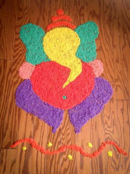 Ganesh rangoli with Rice Rangoli Designs With Rice Grains, Ganesh Rangoli, Ganesha Rangoli, Ganesha Artwork, Pookalam Design, Ganesh Chaturthi Decoration, Colorful Rangoli, Rangoli Designs Latest, Simple Rangoli Designs Images