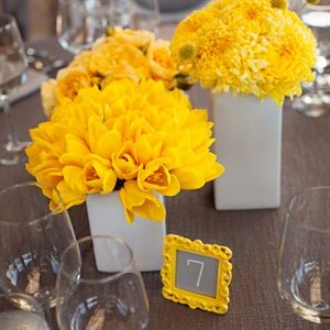 Bright Yellow Centerpieces and Table Numbers. Love the ideas, the bright yellow, not so much. Mums Centerpiece, Yellow Flower Centerpieces, Yellow Wedding Centerpieces, Gray Tablecloth, Picture Wedding Centerpieces, Yellow Mums, Yellow Flower Arrangements, Yellow Centerpieces, Yellow Weddings